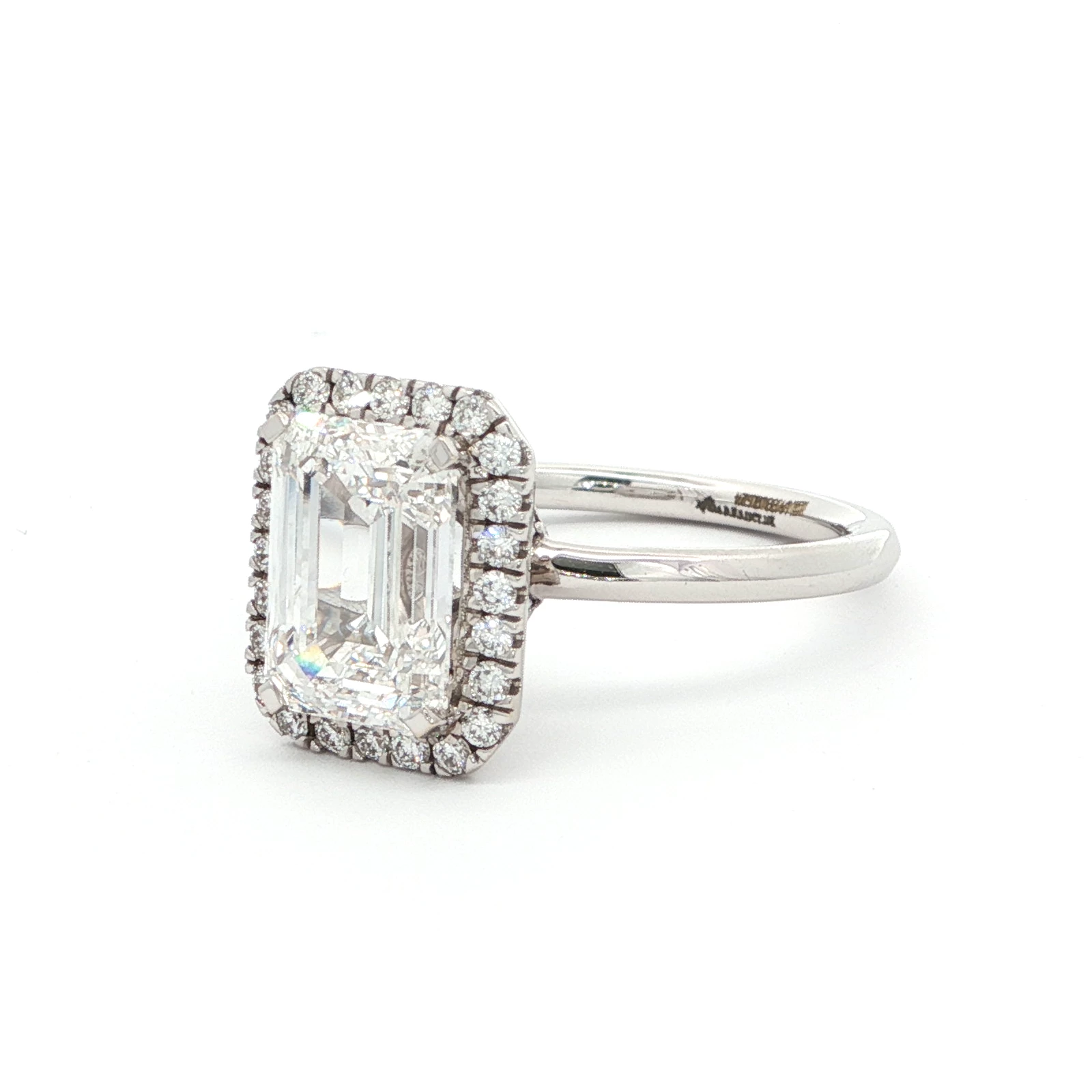 EMERALD HALO DIAMOND RING